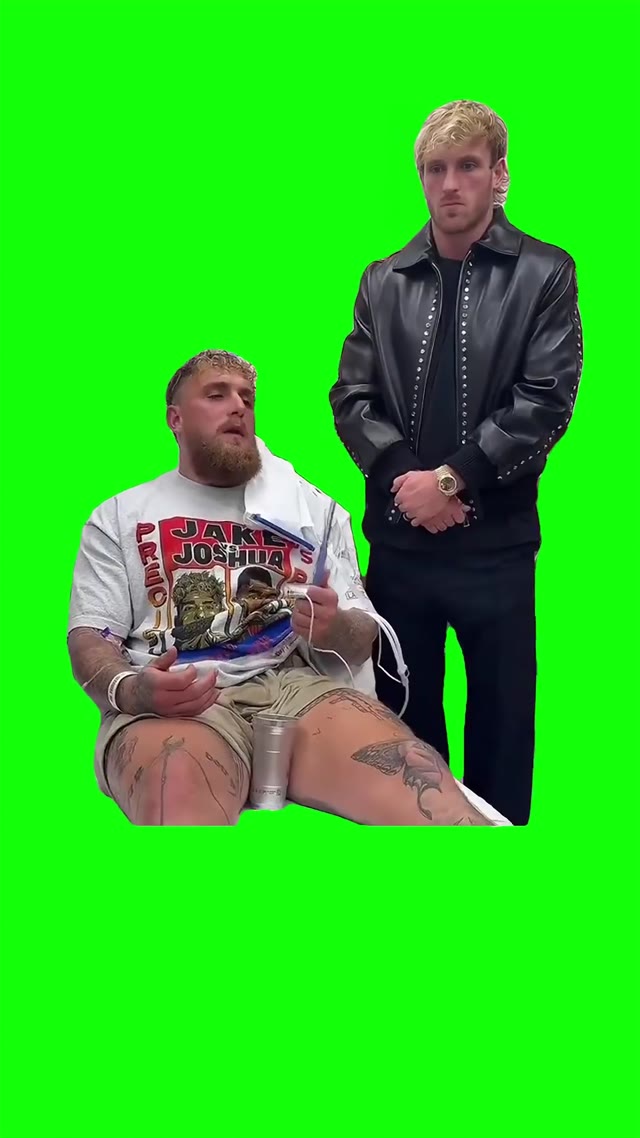 Logan standing next to Jake green screen